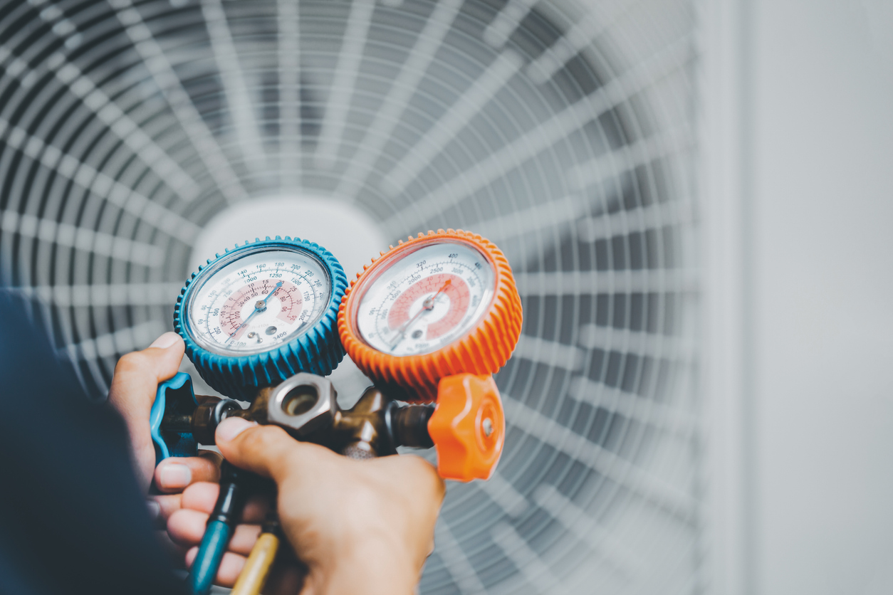HVAC Tech Using Tools